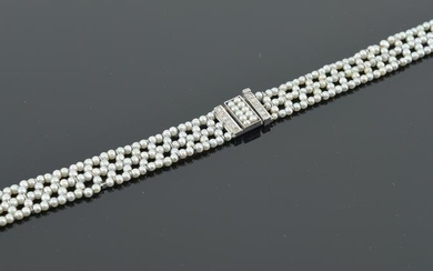 Antique platinum sea pearl and diamond watch bracelet.