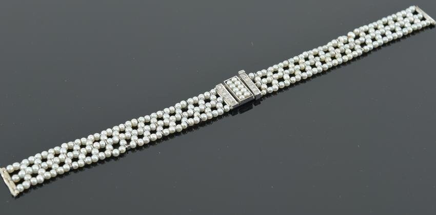 Antique platinum sea pearl and diamond watch bracelet.
