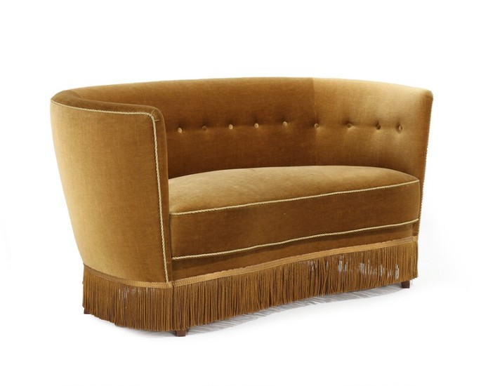 Danish furniture design: Curved sofa with stained beech legs, upholstered with yellow velour, fitted with buttons, below with fringes. 1930–40s. L. 150 cm.