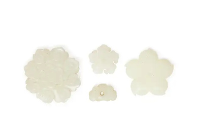 Four Chinese white jade 'flower' ornaments Qing dynasty, 18th century Comprising a...