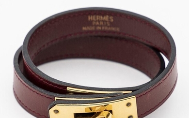 SOLD. Hermès: A "Kelly Double Tour" bracelet of dark red calf leather with gilded metal. Diam. app. 5.5 cm. – Bruun Rasmussen Auctioneers of Fine Art