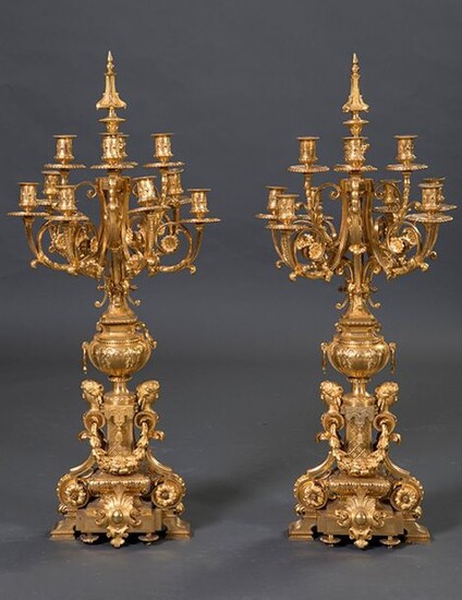 Large pair of ten-light candlesticks in mercury-golden bronze, Napoleon III, France, c. 1860. Vase shaped shaft with decoration of female busts and laurel garlands. Height: 95 cm. Exit: 10000uros. (1.663.860 Ptas.)