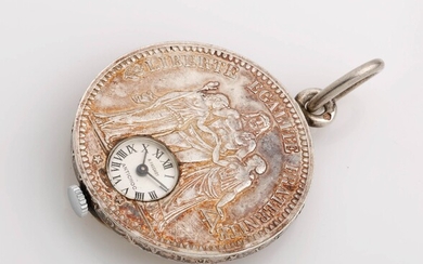 Montre pendentif en argent adaptée sur une pièce de dix francs en argent de 1873....