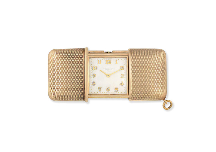Movado. A 9K gold manual wind purse watch, Retailed by Hausmann & Co