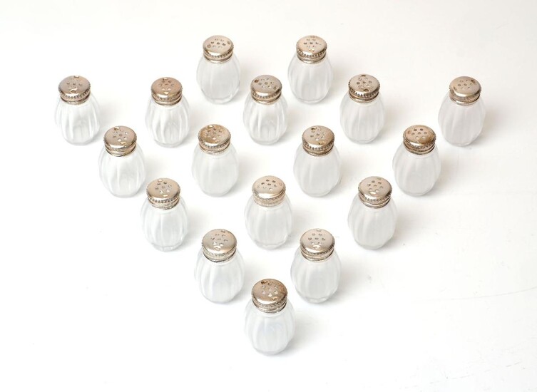 Seventeen silver mounted glass cruets, by Christofle, each designed with panelled ovoid glass body to perforated silver cap (17)