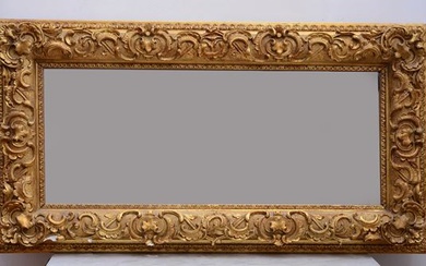Specchiera con cornice in legno e pastiglia, alcuni difetti, XX secolo, cm 56x104