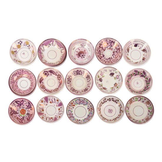 Twenty Two Pink Luster Saucers.