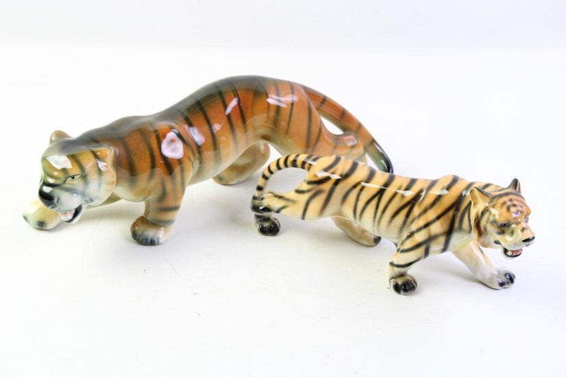 Two ceramic glazed tiger figures (length of largest 38cm)