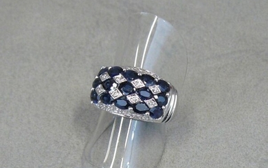 A white gold ring (eagle), set with fifteen sapphires alternating...
