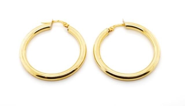 18ct yellow gold hoop earrings marked 750. Approx width 30mm...