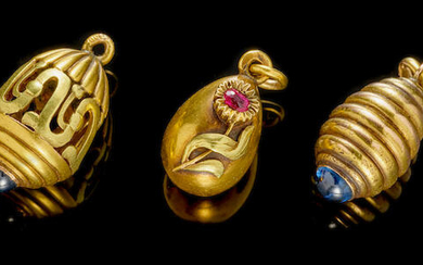 Three jewelled gold miniature eggs