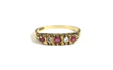A 9ct gold carved head five stone graduated ruby and diamond ring