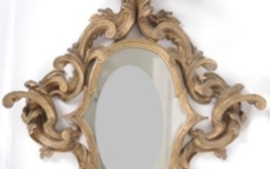 Miroir italien XIXème en bois sculpté, doré et ajo…
