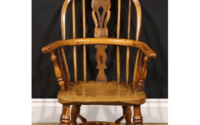 A 19th century yew and elm child’s Windsor elbow chair, pier...