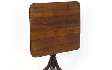 A 19thC tilt top occasional table with yew wood planked top ...