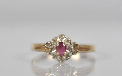 A 9ct Gold, Diamond and Ruby Cluster Ring, Oval Cut Ruby Mea...