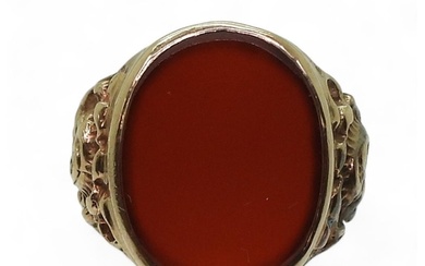 A 9ct gold carnelian signet ring, with flower embossed shoul...