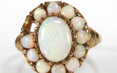 A 9ct yellow gold cluster ring set pale opals, ring...
