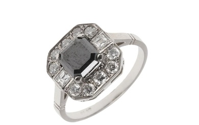 A BLACK DIAMOND AND DIAMOND CLUSTER RING. mounted with an oc...