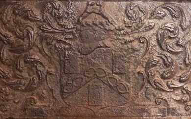 A CAST-IRON FIREBACK WITH THE ARMS OF THE WORSHIPFUL COMPANY OF IRONMONGERS