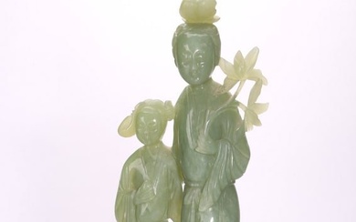 A CHINESE GREEN JADE 'LADY' FIGURAL GROUP