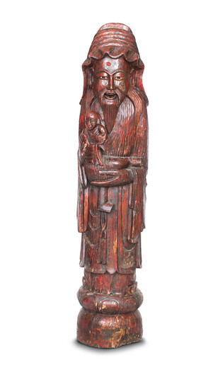 A CHINESE RED LACQUER CARVED ELM FIGURE OF SHOU LAO