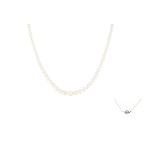 A CULTURED PEARL NECKLACE, to a diamond and ruby 18ct gold c...