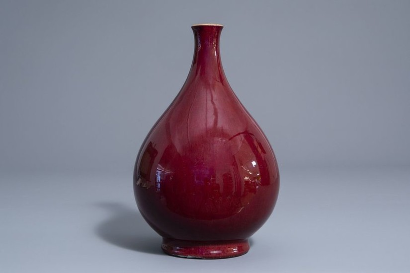 A Chinese monochrome sang de boeuf bottle vase,...
