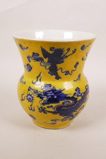 A Chinese yellow glazed porcelain vase with blue and white d...