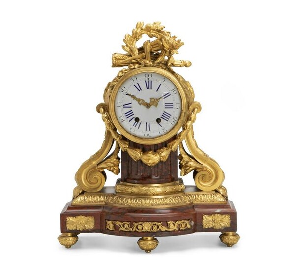 A French Red Rouge Marble And Gilt-Bronze Clock