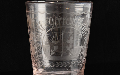 A German beaker, early 19th century, slightly rose-tinted glass mass with engraved decoration.