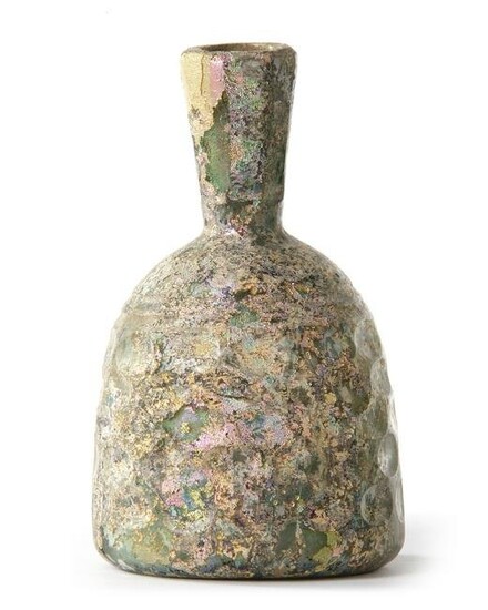 A HONEYCOMB FACTED WHEEL-CUT GLASS BOTTLE, PERSIA, CIRCA 10TH CENTURY