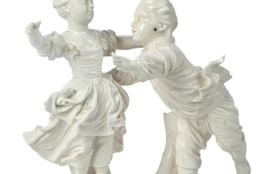 A Hochst porcelain white group of Fangespiel (Playing Tag), c.1770, blue wheel mark, incised mark, modelled by J.P. Melchior, with a young girl and a young boy playing tag, on a grassy rocky mound base, 14.6 cm. high Provenance: Works of Art from...