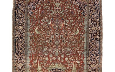 A Kashan Mohtasham rug, Persia. Arch design with trees, cypresses, flowervase and bird motifs. First half 20th century. 197×135 cm.