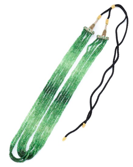 A MULTI STRAND GREEN TOURMALINE BEAD NECKLACE; 6 strands of graduated faceted green tourmaline beads 2.6-3.3mm to black silk chord a...