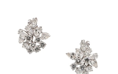 A PAIR OF DIAMOND CLUSTER EARRINGS. each earring set with br...