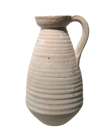 A Punic ceramic jug with ribbed body
