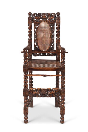 A RARE CHARLES II CARVED WALNUT AND CANED CHILD'S HIGH CHAIR, CIRCA 1660