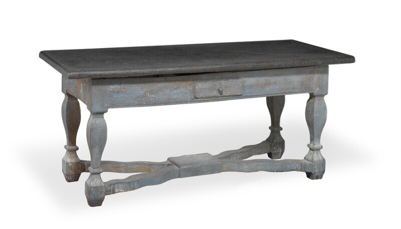 A Swedish stone top table with profiled top of Komstad stone. Scania, 18th/19th century. H. 79 cm. L. 181 cm. W. 80 cm.