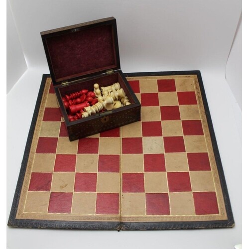 A TURNED IVORY CHESS SET, white & red stained, the king 9cm ...