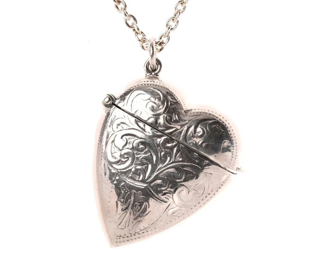 A VICTORIAN STYLE STERLING SILVER HEART SHAPE VESTA LOCKET ON CHAIN; 3.5 x 4cm scroll engraved case on a cable link chain, length 60...
