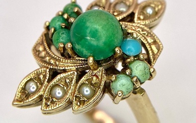 A VINTAGE 9K GOLD RING DECORATED WITH TUQUOISE AND...