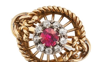 A VINTAGE RUBY AND DIAMOND RING in yellow gold, set with a round cut ruby in a cluster of old cut