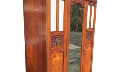 A Victorian mahogany wardrobe with moulded cornice above a central...