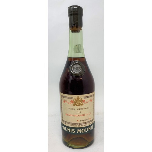 A bottle of Denis Mounie Grande Champagne brandy, 1918, in a...