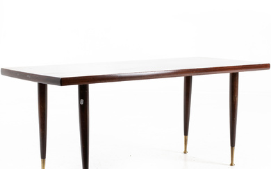 A coffee table, with brass leg ends, stained top, circa mid 20th century.