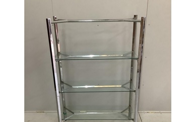 A contemporary chrome and glass three tier shelf unit, width...