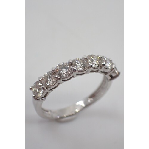 A diamond 7 stone ring set in 18ct gold total estimated weig...