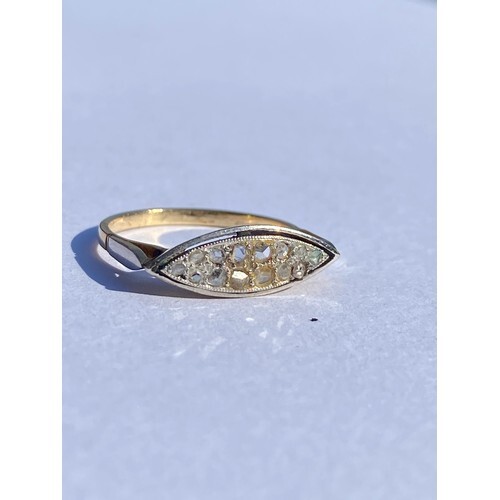 A diamond ring, set with a panel of rose cut and mixed cut d...
