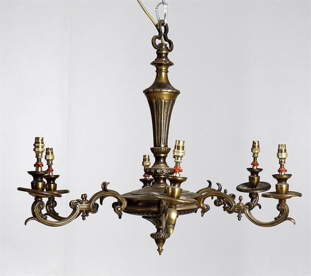 A gilt metal six light chandelier in the Louis XVI taste